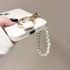 Camellia Flower and Puppy Pearl Charm Leather Crossbody Lanyard Phone Case for iPhone 13 Series